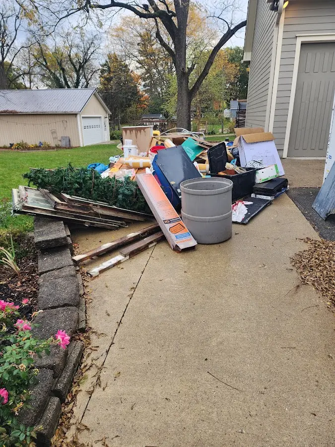 Dumpster being loaded with debris for Demolition Dumpster Rental in Woodmoor